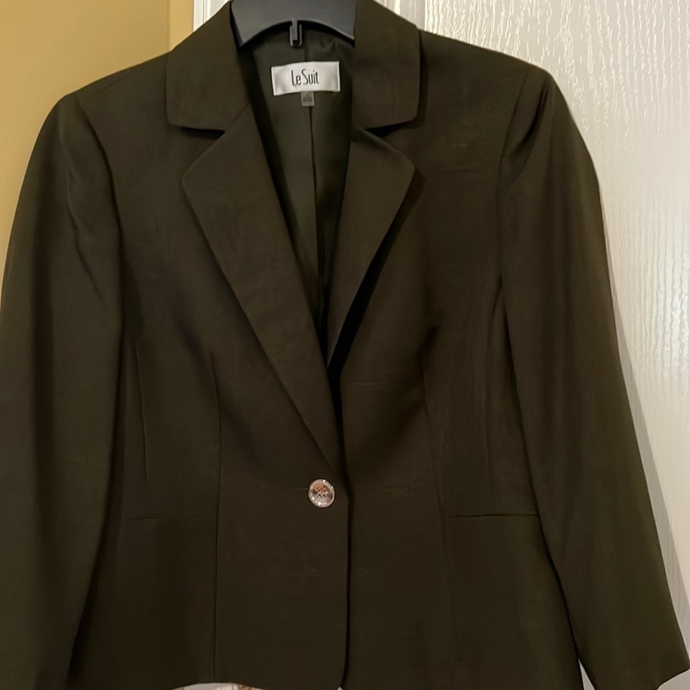 two piece skirt suit size 12 never worn new with tags.  Olive green